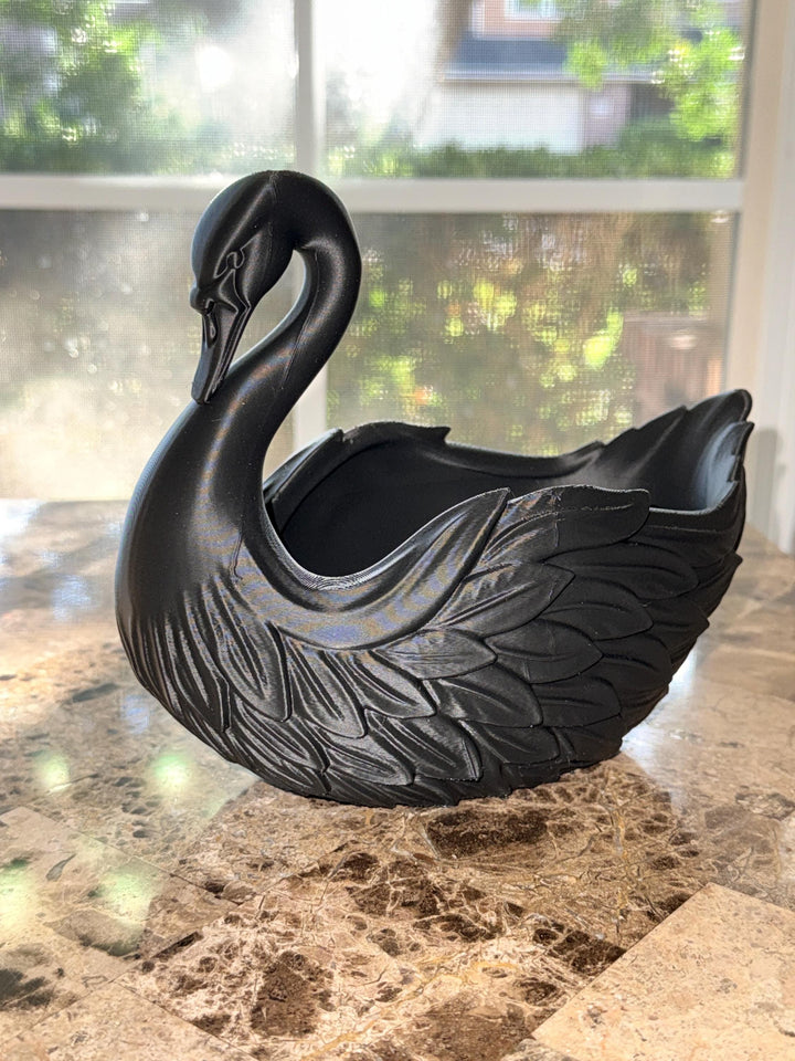 Elegant, mysterious, and functional — this Black Swan centerpiece adds a touch of gothic sophistication to any space.